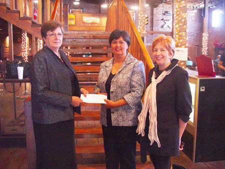 Delta State University Associate Vice President for Finance and Administration Dr. Myrtis Tabb (l) accepts a check for $2,500 from Cheryl Comans, customer service manager for Entergy Mississippi, as Roseann Buck, executive director of the Bologna Performing Arts Center looks on.  The Entergy contribution was a donation on behalf of Entergy Mississippi. Entergy and its Charitable Foundation awarded grants totaling $15.7 million to almost 3,000 nonprofit organizations in 2009.